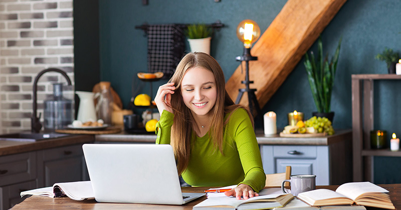 Woman working on her business from home